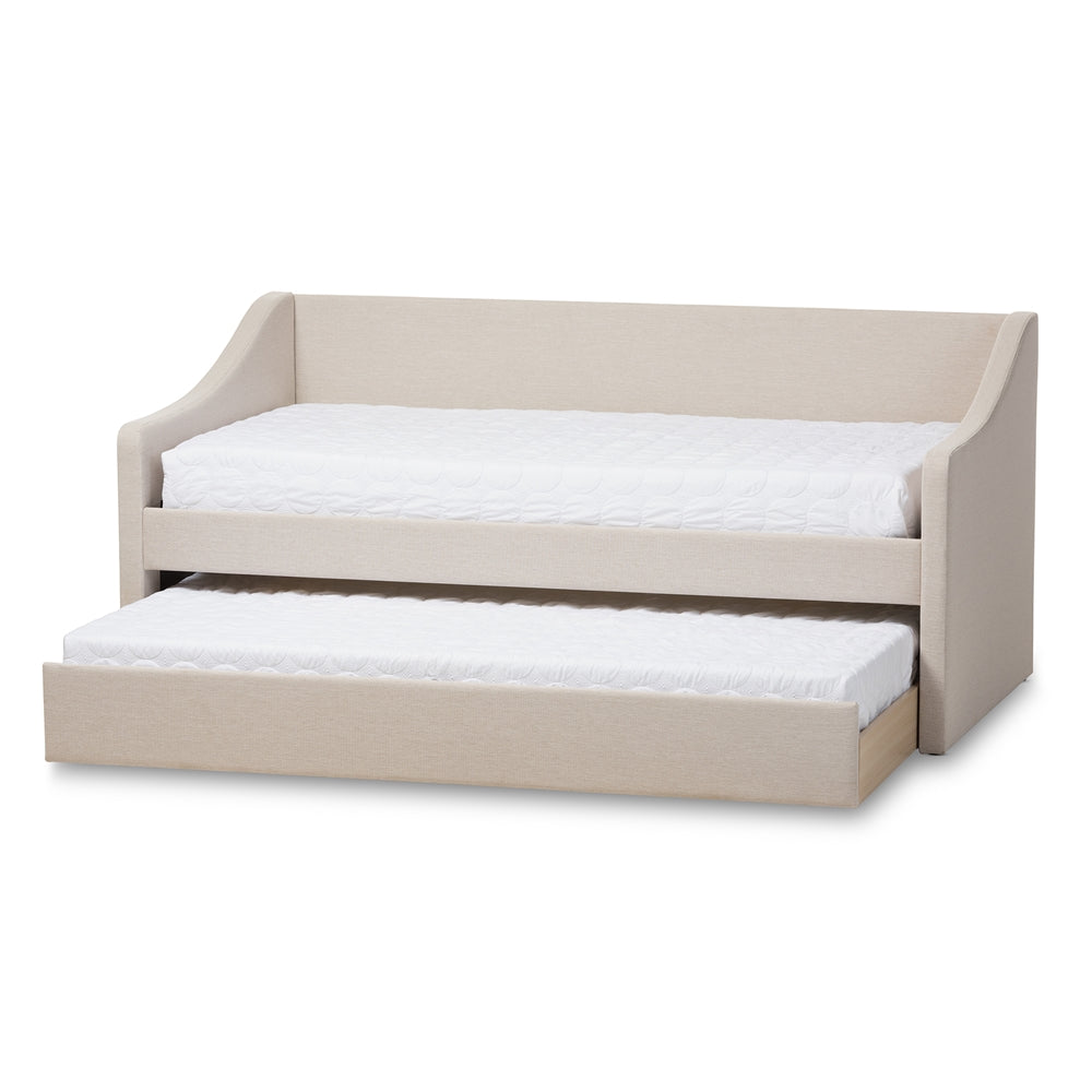 Beige upholstered daybed with its twin trundle bed rolled out underneath