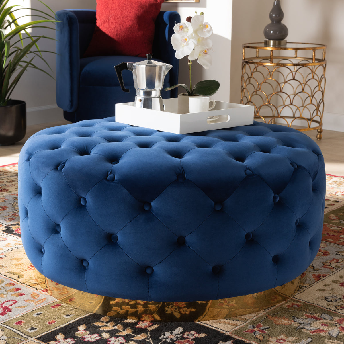 Sasha and Royal Blue Velvet Fabric Upholstered Gold Finished Round Cocktail Ottoman