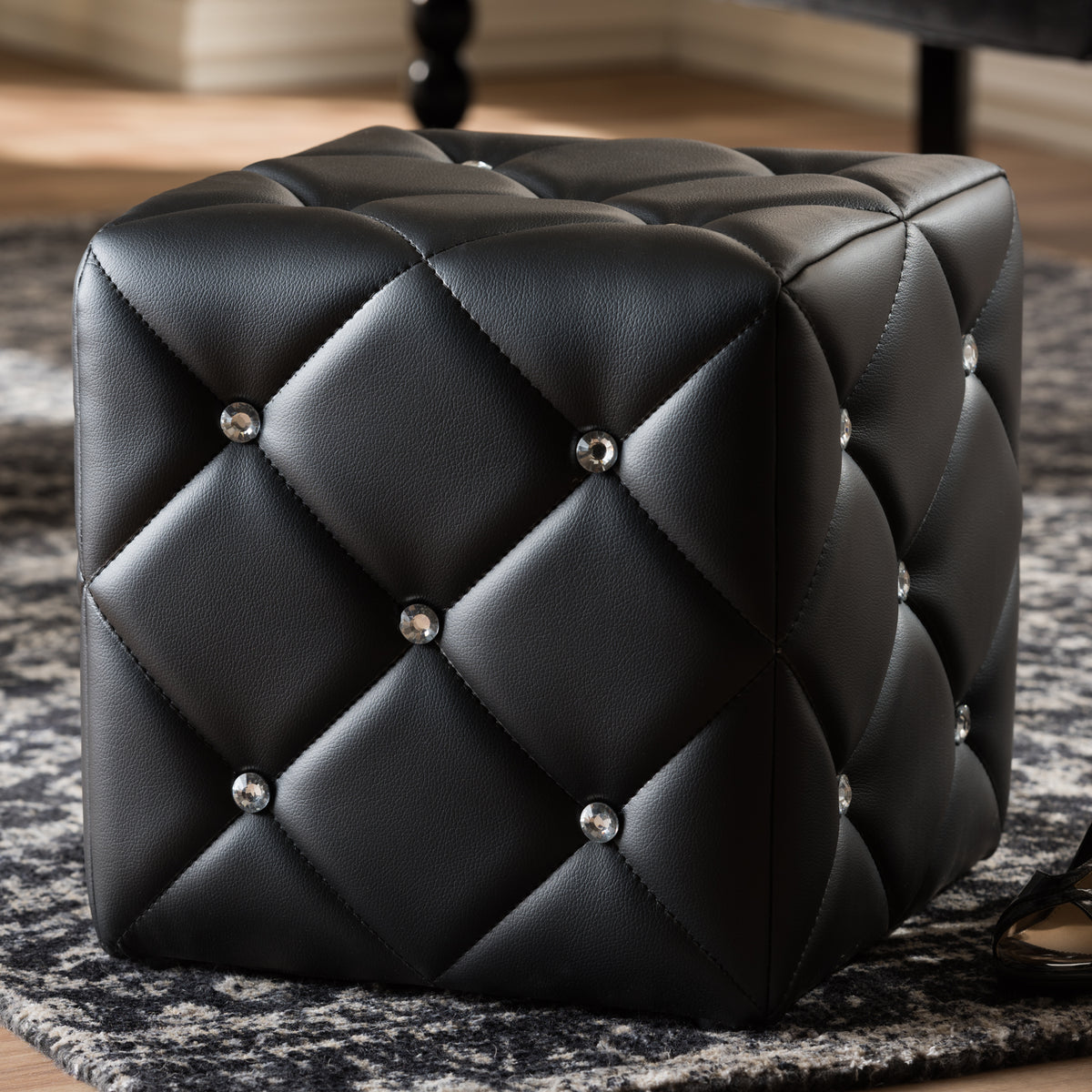 Stacey Modern and Contemporary Black Faux Leather Upholstered Ottoman