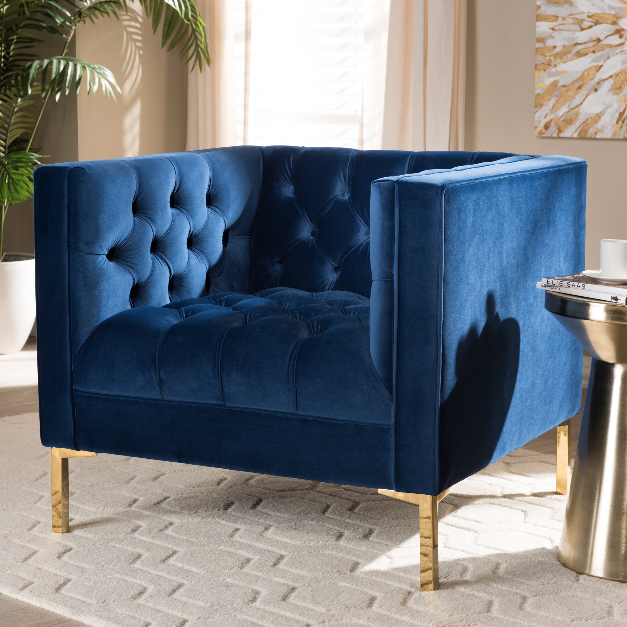 Zanetta and our Navy Velvet Upholstered Gold Finished Lounge Chair