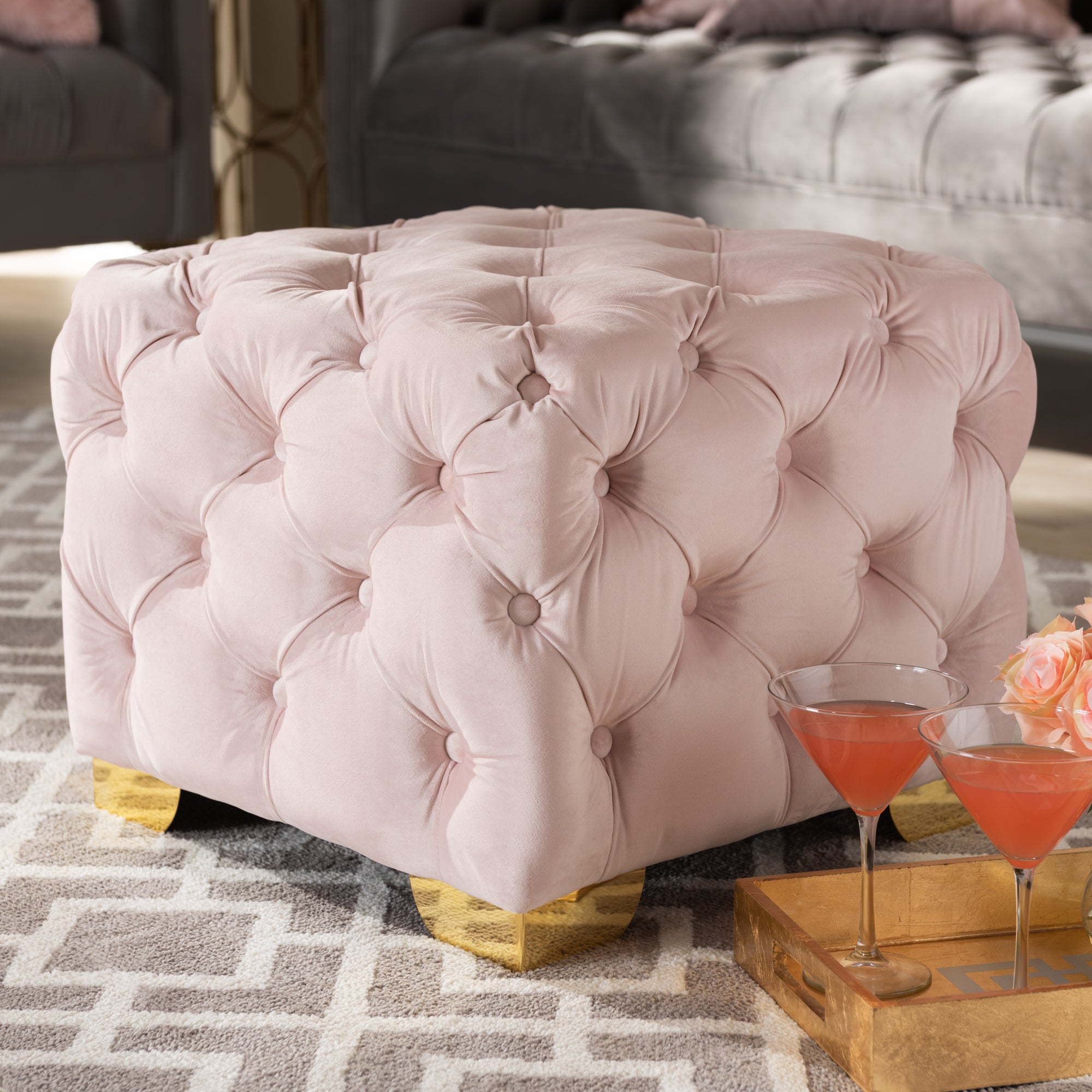 Avara Light Pink Velvet Fabric Upholstered Gold Finished Button Tufted Ottoman