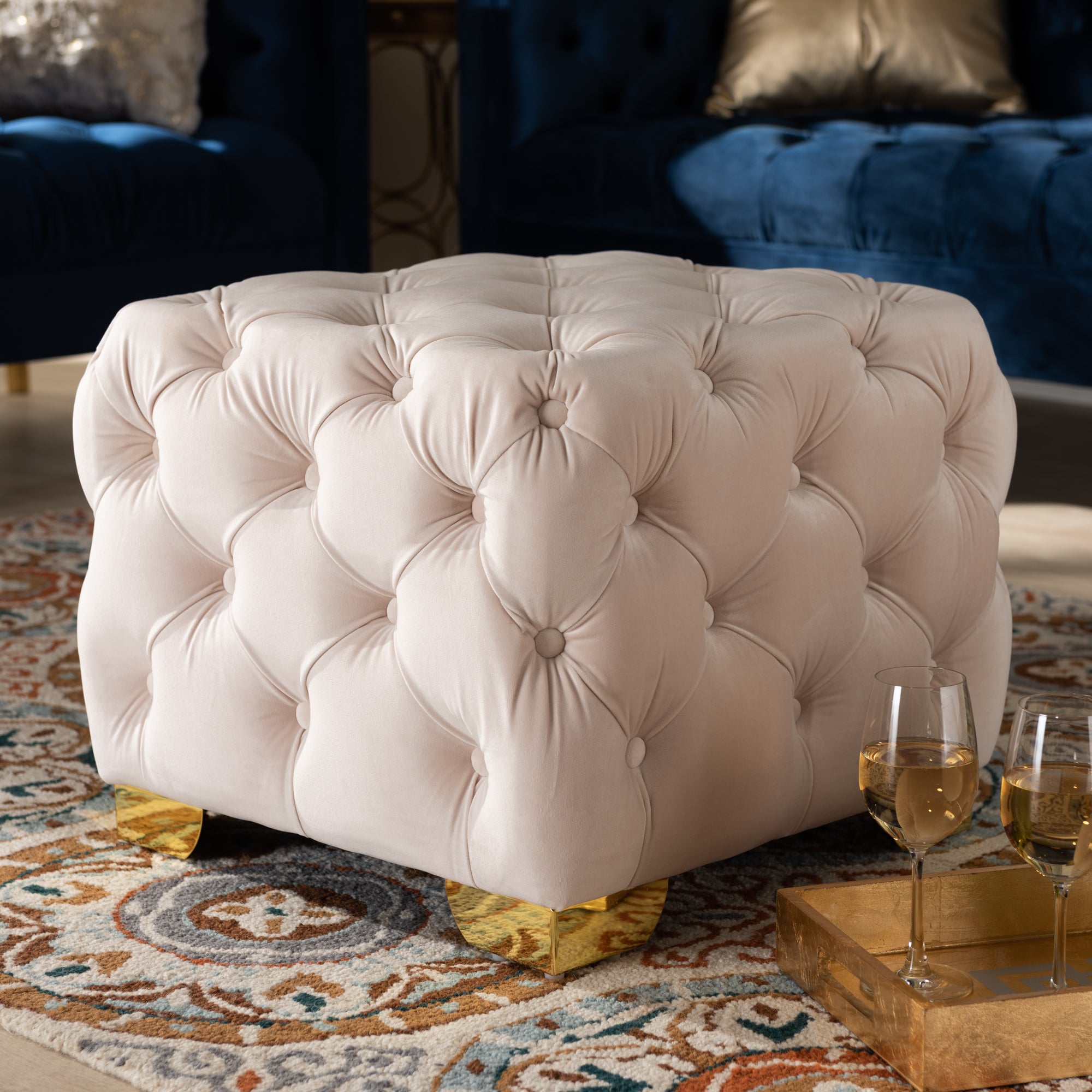 Avara Light Beige Velvet Fabric Upholstered Gold Finished Button Tufted Ottoman